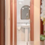 Cuarto de baño desde habitación con planta